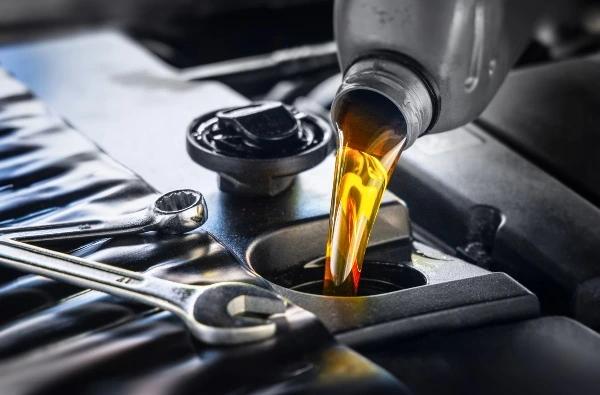 Oil being poured into car engine